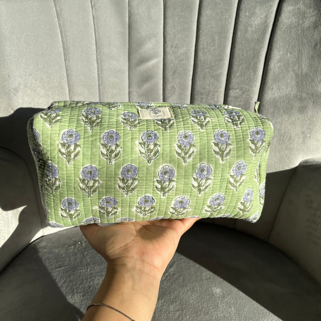 evergreen-grace-toiletry-bag-in-hand